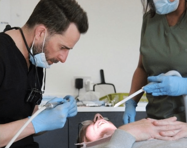 An experienced Rugby Smiles clinician treating a relaxed patient